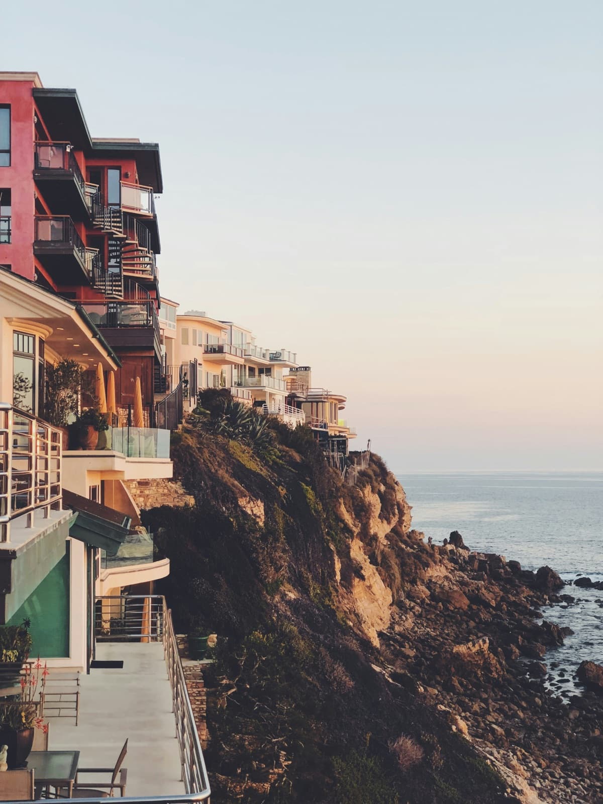 Modern homes overlooking a rocky coastline