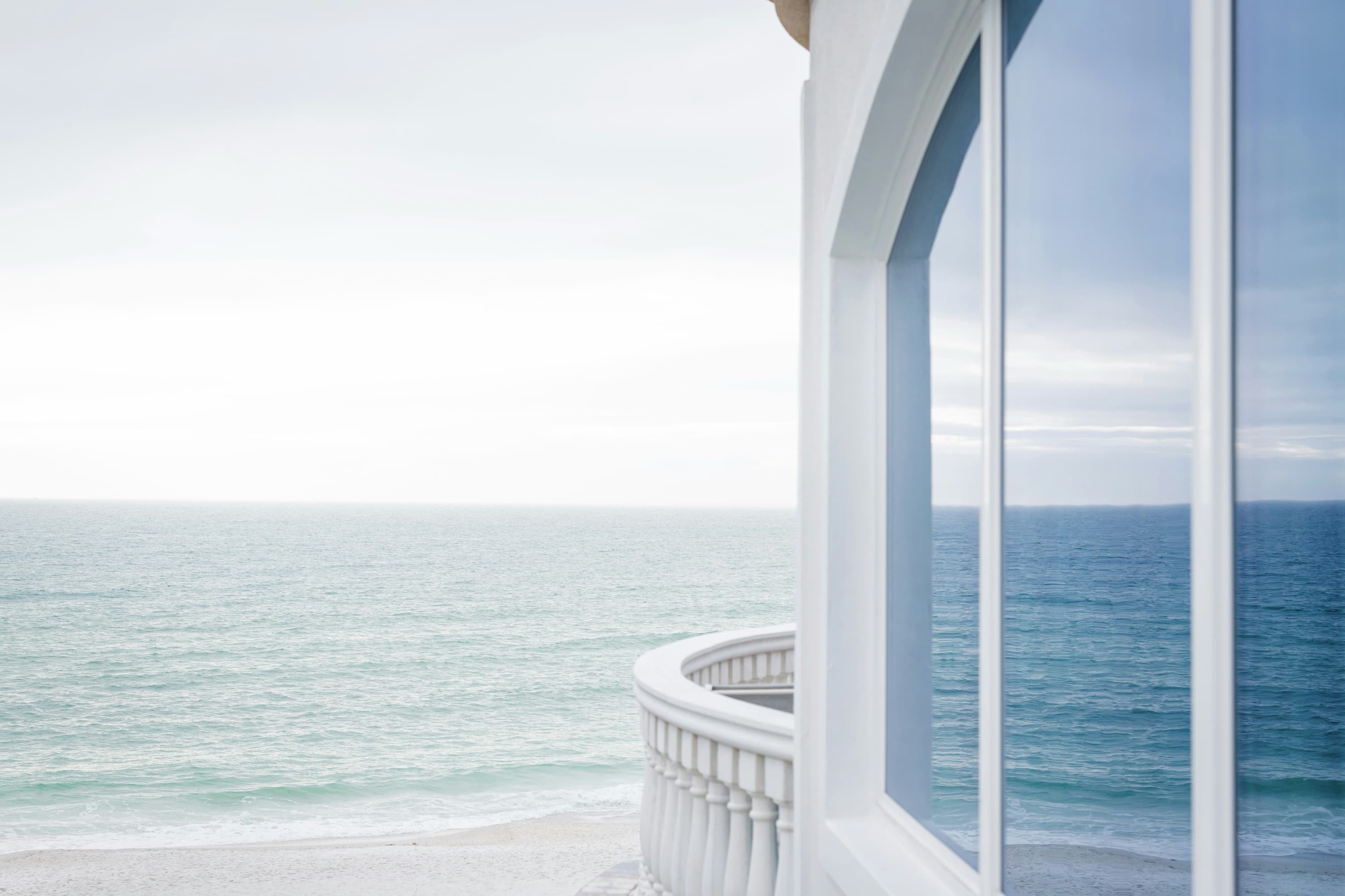 Coastal view through a large impact window
