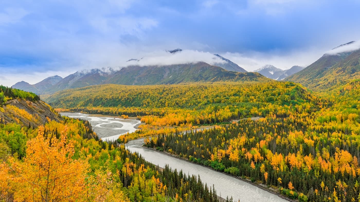 Scenic view of an Alaskan river and mountain landscape in Alaska