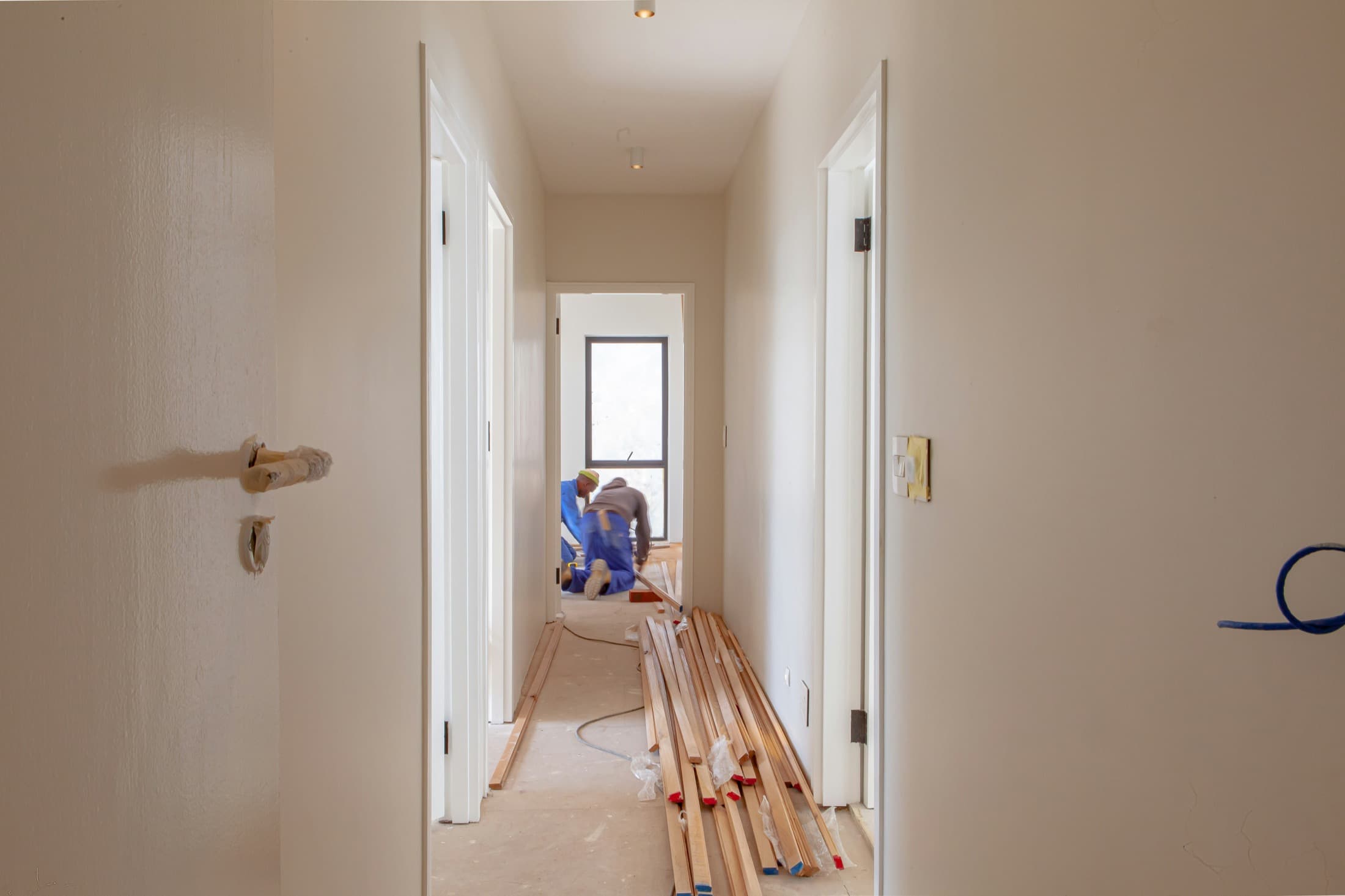 Construction professionals working inside a residential project